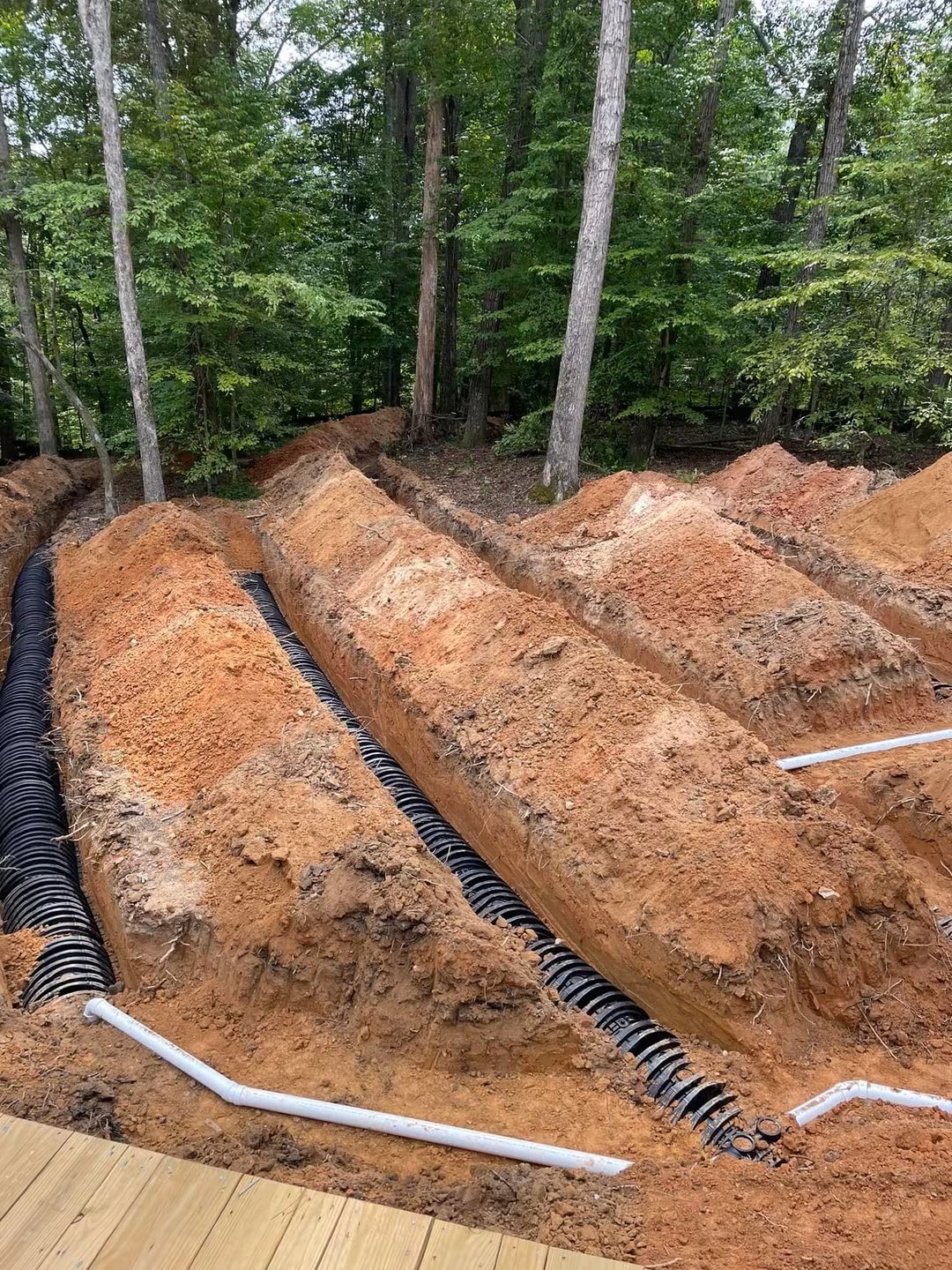 Chamber drainfield lines installed in a wooded residential lot