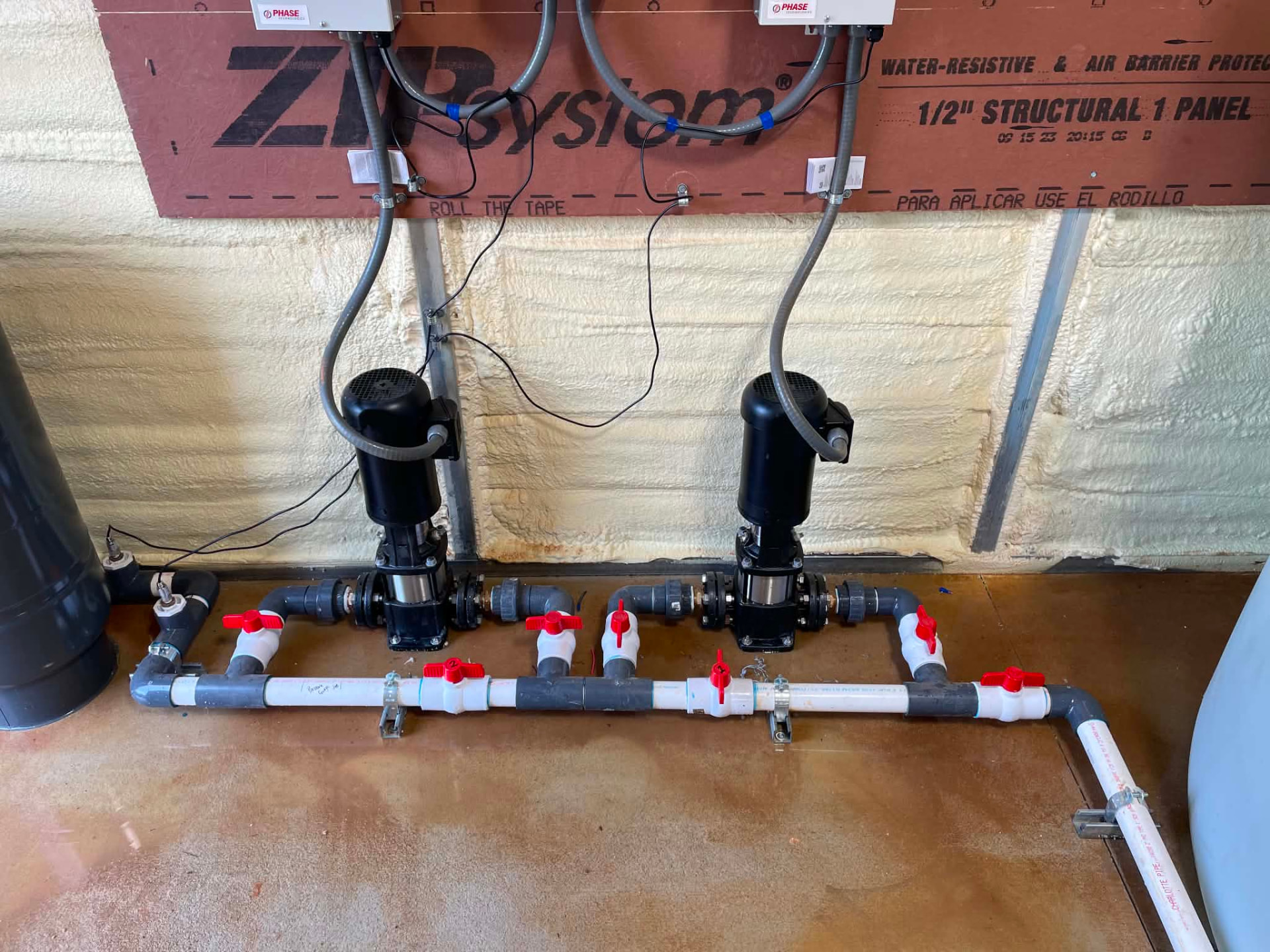 Paired booster pumps with valved manifold piping in an EMS-operated facility